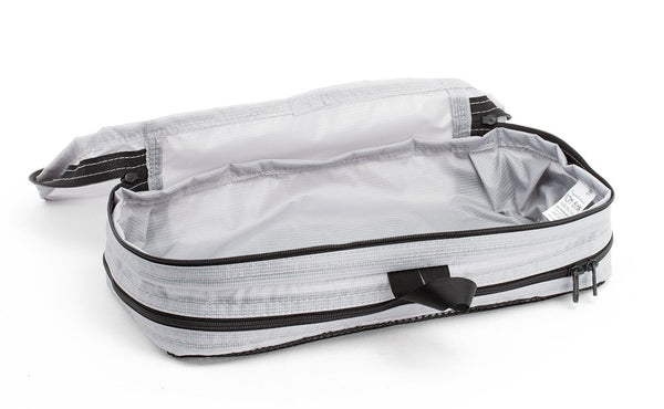 An empty and open Northwest Sky (light grey) Aether Small Aeronaut 30 Packing Cube open all-fabric side up.